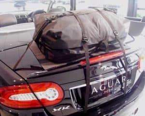 close up of the rear of jagaur xk convertible with a luggage rack fitted