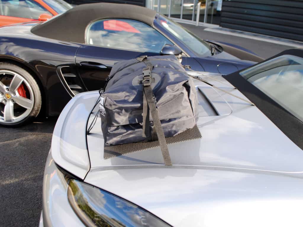 side view of a boot-bag original trunk luggage rack fitted to a silver 718 962 fourth generation Boxster