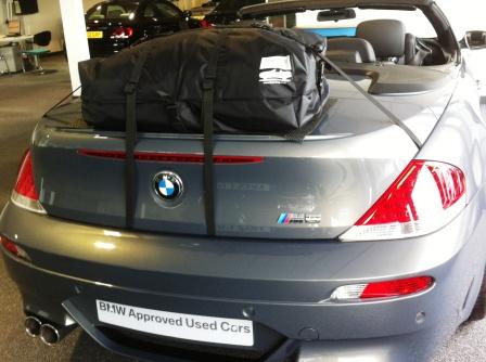 grey bmw m6 convertible with a boot-bag luggage rack fitted