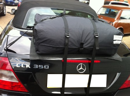 rear view of a black mercedes clk convertible with a boot-bag luggage bot rack fitted