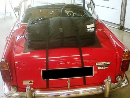 red triumph tr5 with a boot-bag original luggage rack fitted