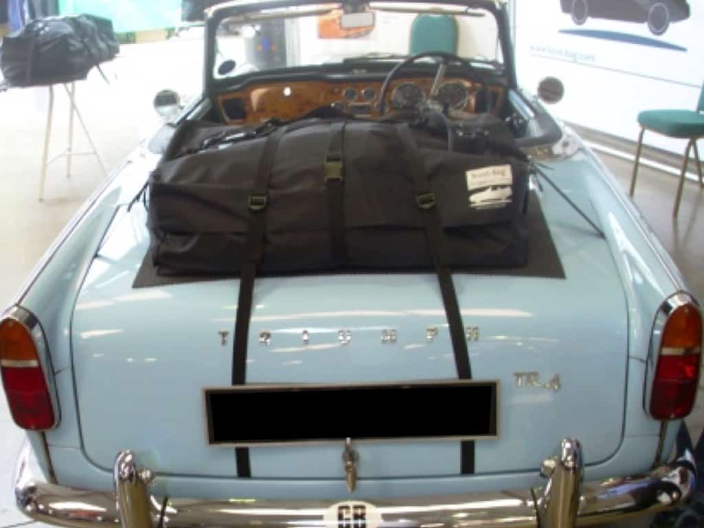powder blue triumph tr4 with a boot-bag original luggage rack fitted