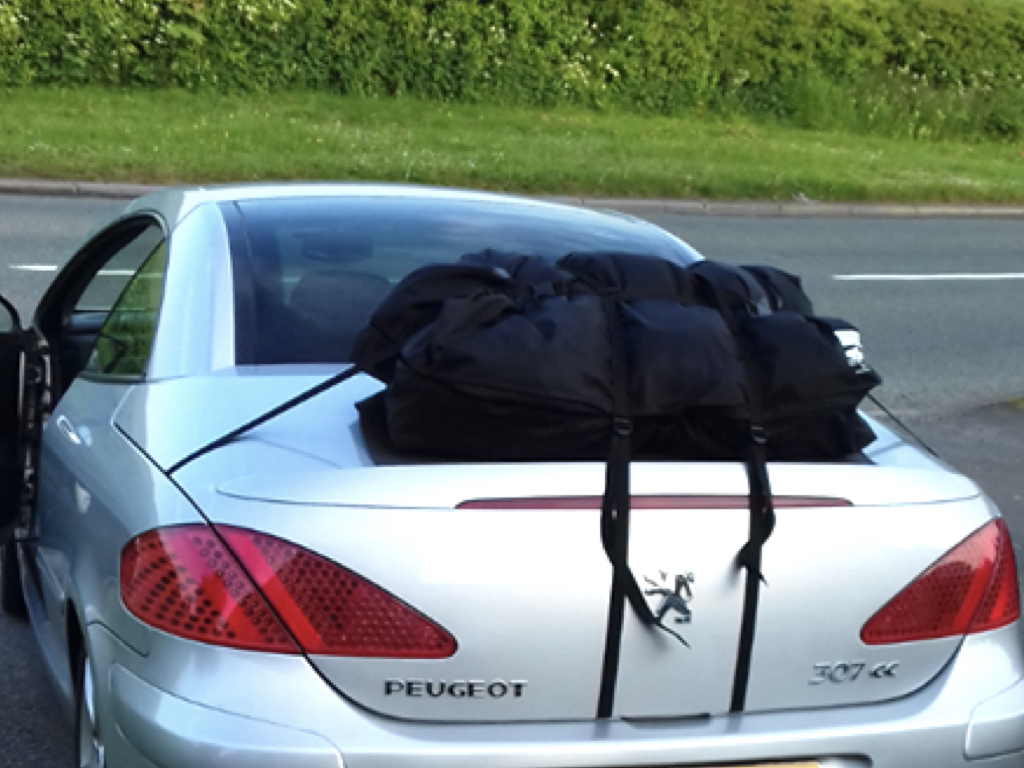 silver peugeot 307cc with a boot-bag luggage rack fitted