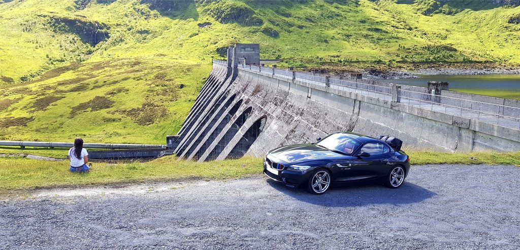 black bmw z4 e89 next to a lake and dam with a boot-bag luggage rack fitted