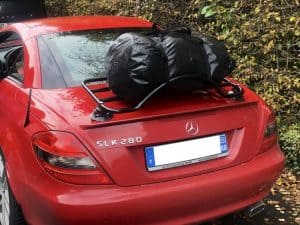 red mercedes slk with a revo-rack luggage rack fitted carrying a black bag