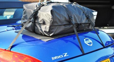 side view of a boot-bag original luggage rack fitted to a blue nissan 350z roadster