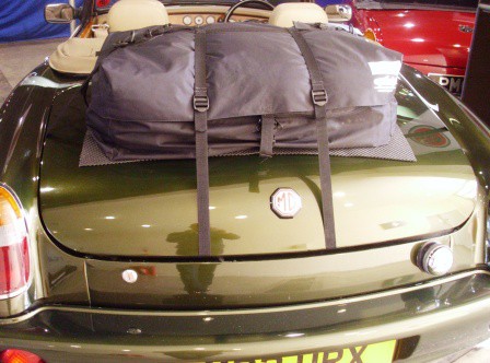 light green mgr v8 with the hood down and a boot-bag original boot & luggage rack fitted