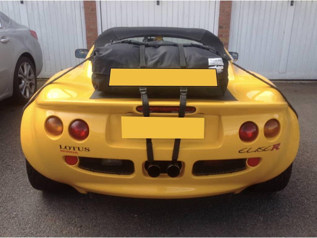 Yellow lotus elise with a boot-bag original luggage rack fitted