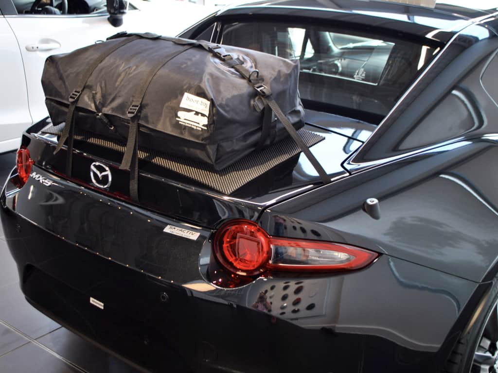 black mazda mx5 rf with a boot-bag original luggage rack fitted