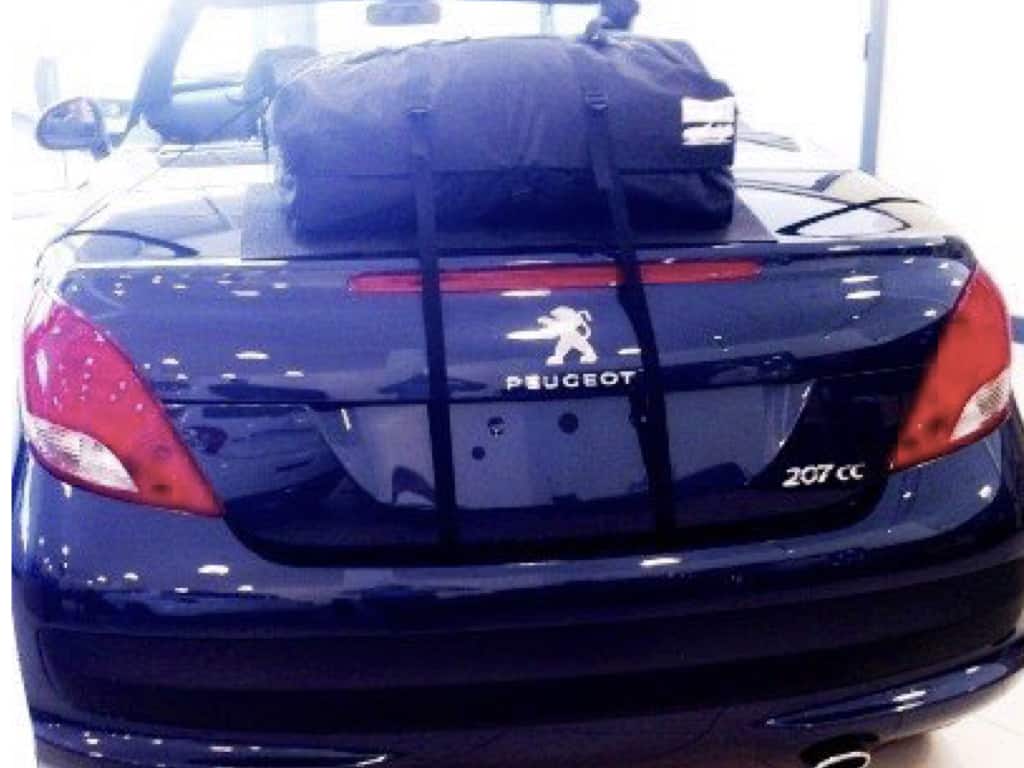 black 207cc in a peugeot garage with a boot-bag original luggage rack fitted