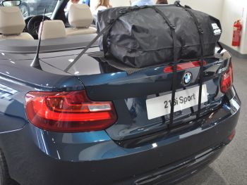 blue bmw 2 series convertible with a boot-bag original luggage rack fitted to the boot lid