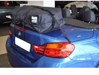 blue bmw 4 series cabrio with a bootbag vacation luggage rack fitted