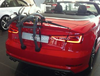 audi cabriolet in red hood down with a bike rack fitted