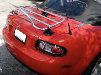 mazda mx5 mk3 nc stainless steel luggage rack fitted to a red mx5 in sunshine