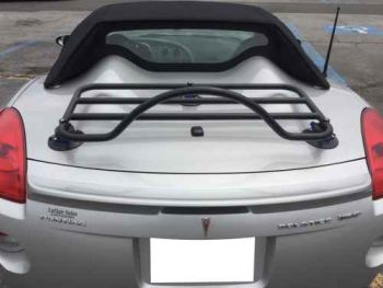 Silver Pontiac solstice with a black revo-rack luggage rack fitted