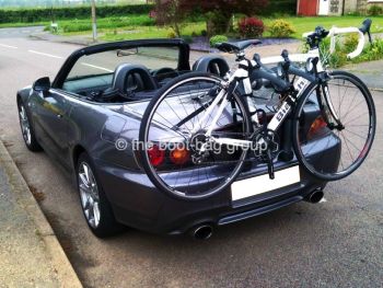 grey honda s2000 with a bike rack fitted