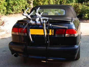 black saab 93 convertible with a bike rack fitted